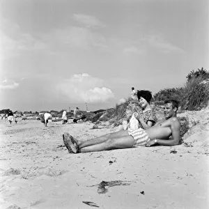 Pop singer Marty Wilde and his 19-year-old wife Joyce on the beach at Shell Bay, Dorset