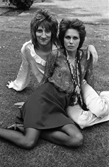 Pop singer Rod Stewart with his new girlfriend actress Joanna Lumley in her garden at her