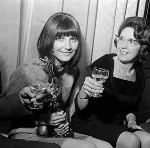 Pop singer Sandie Shaw holding the Mirror award for coming Number One in the Hit parade