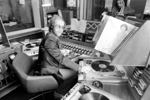 Pop Star: Elton John. Elton John records his first programme as a disk jockey at the BBC