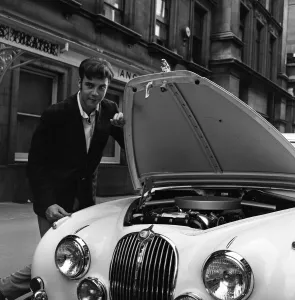 01212 Prints: Pop star Marty Wilde, 22, is given a parking ticket after parking his cream Jaguar