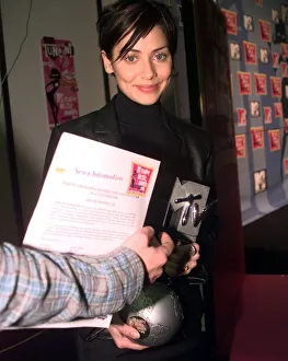 Pop star Natalie Imbruglia picks up her award at the MTV Music Video Awards ceremony in