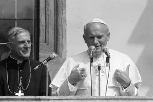 Pope John Paul II gives a blessing from a balcony during his visit to Ireland