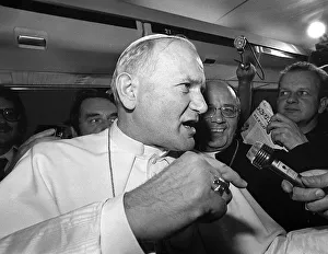 Anger Prints: Pope John Paul II is interviewed during a flight on his visit to Ireland