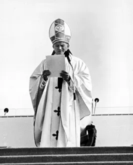 Religious Leaders Prints: Pope John Paul II reads his address from podium during Mass at Heaton Park, Manchester