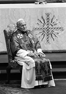 Tired Prints: Pope John Paul II during his visit to Britain in 1982 conducts a joint service withe