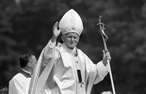 Pope John Paul II waves to the welcoming crowd at Cardiff airport, 2nd June 1982