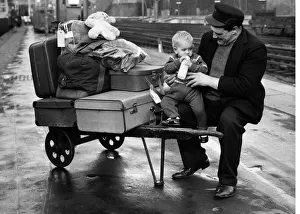 Porter Wally Lawes of Euston Station London was left holding the baby, 1 year old Deidre