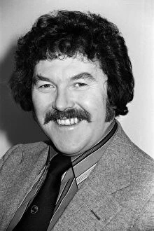 01022 Collection: Portrait of Dickie Davies, television sports commentator. February 1976