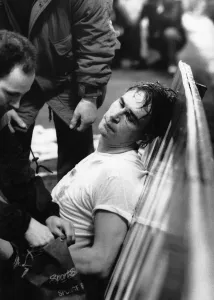 Injury Prints: Portsmouth goalkeeper Alan Knight (centre) is injured after a clash with John Fashanu of