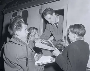 Portsmouth Player at Euston Station en route to Bolton signing autographs for happy