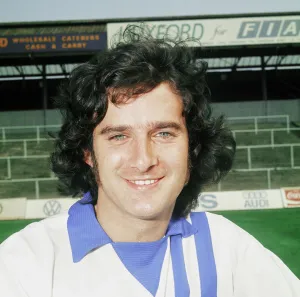 Away Kit Prints: Portsmouth player Norman Piper poses on the pitch at Fratton Park. August 1975