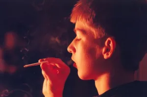 A posed model picture of an underage smoker 1st January 1990