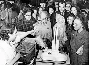 Post World War Two - Second World War - A crowd gathers at the biscuit counter of