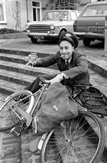 Postman Trevor Bennett celebrating his good news with a glass of champagne