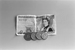 Sterling Prints: A five pound note and seventy five pence in change. 8th February 1988