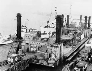 D Day Prints: Prefabricated Ports. Picture shows: LST Spud pierhead assembly showing clearing