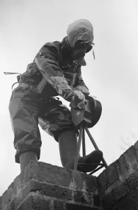 Preparations for war. ARP warden operates the air raid siren during a civil defence gas
