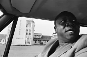 African Prints: President Idi Amin at the wheel of his Range Rover at Entebbe Airport near Kampala