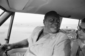 00332 Prints: President Idi Amin at the wheel of his Range Rover at Entebbe Airport near Kampala