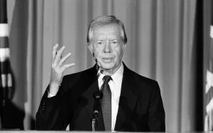 00910 Prints: Former President Jimmy Carter talks to the press at the American Embassy on overseas