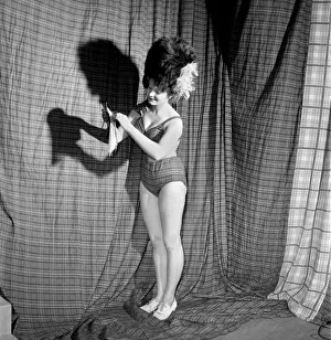 Pretty 19-years-old Pat Landon could almost be accused of cutting up the curtains for her
