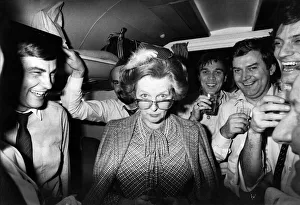 Prime Minister Margaret Thatcher seen here with Journalist on her plane returning to