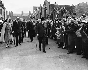 Cheering Prints: Prime Minister Winston Churchill greeted by enthusiastic crowds as he tours the bomb