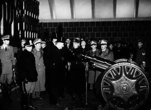 00133 Prints: Prime Minsiter Neville Chamberlain visits a munitions factory in Italy Circa 1937