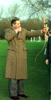 Archer Prints: Prince Charkes is presented with bow for Prince Harry at Wellow House school in