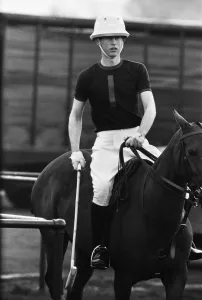 Prince Charles in action during his first polo game at Windsor Park alongside his father
