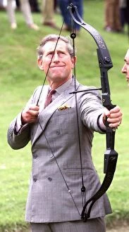 Images Dated 12th May 1999: Prince Charles has a go at Archery during visit to Clay Pigeon Shoot in aid of Princes