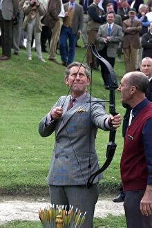 Images Dated 12th May 1999: Prince Charles has a go at Archery during visit May 1999 to Clay Pigeon Shoot in