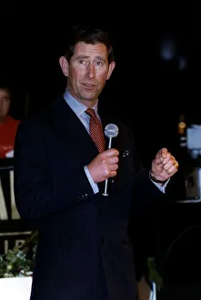 Prince Charles in dark suit holding microphone April 1993