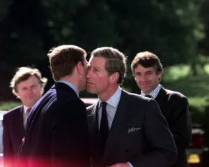 Prince Charles and the Duke Of York embrace June 1998 The two Princes kiss
