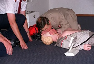 Dummy Prints: Prince Charles getting up close and personal with a rescussitation dummy