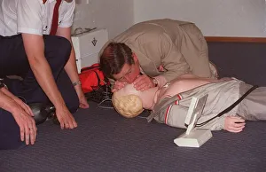 Prince Charles getting up close and personal with a resussitation dummy