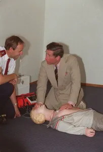 Prince Charles getting up close and personal with a resussitation dummy