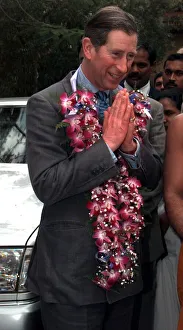 Prince Charles hands together as he arrives in Colombo in Sri Lanka in February 1998
