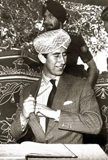 Turban Prints: Prince Charles in India 1980 Presented with a golden turban during his tour while