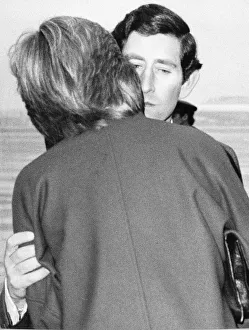 Prince Charles kisses Lady Diana Spencer goodbye at Heathrow Airport before leaving for