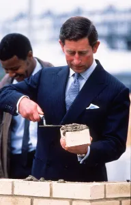 Prince Charles lays a brick at start of a housing scheme September 1988