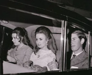 Prince Charles with Lucia Santa Cruz (centre) in car on theie way to the Fortune Theatre