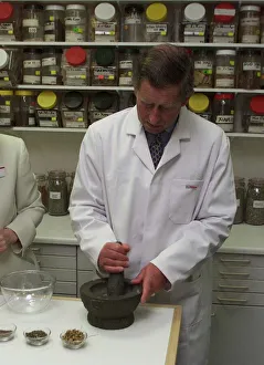 Prince Charles makes Herbal Medicine at University of Westminster. Wearing lab coat