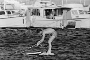 01384 Prints: Prince Charles pictured windsurfing near Perth during his visit to Australia. March 1979
