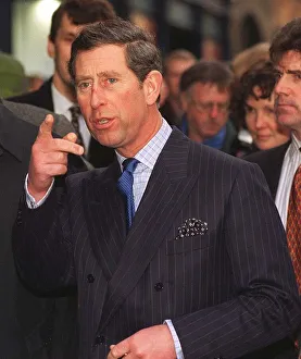Prince Charles pointing right finger as he enters the Tron Church in Edinburgh