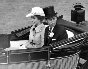 Prince Charles, Prince of Wales with his sister Princess Anne drive down the course