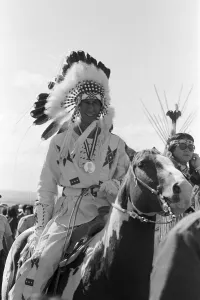 Prince Charles, the Prince of Wales, wearing Indian headdress in Calgary