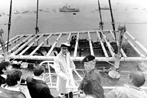 00191 Prints: Prince Charles seen on the crane Tug Mor with the War Ship of Henry VIII as she breaks