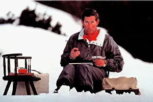 Prince Charles sits down and paint during an Alpine skiing holiday February 1994